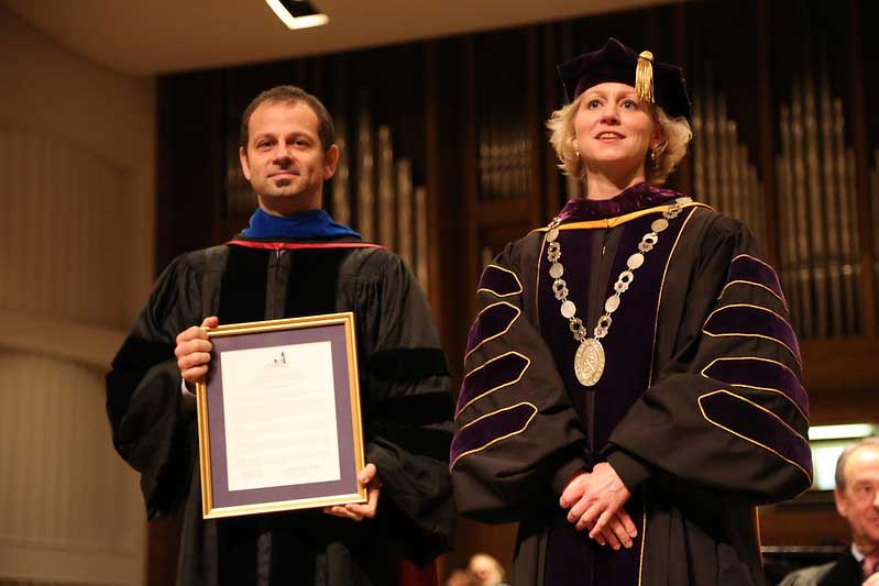 Dr. Reichwald receives an award from President Fleming.