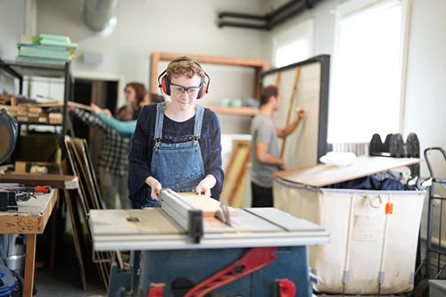 Converse students build a set for a theatre production