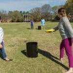 Students playing with frisbees