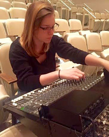 Emily Hardy runs the soundboard at the Beatles tribute show