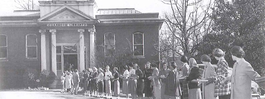 Students forming a "book brigade" from Carnegie Library to Gwathmey Library