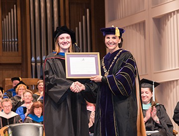 Chandra Owenby Hopkins receives the CATO award from President Newkirk