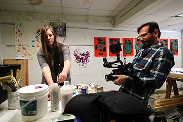 Jeffrey Scott Gould films Jessica Gilbert working on her art