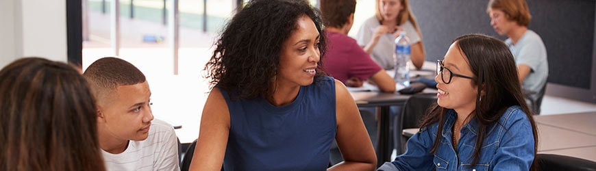 Image of teacher with teenage students