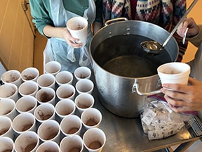 Preparing hot chocolate at the Soup Kitchen