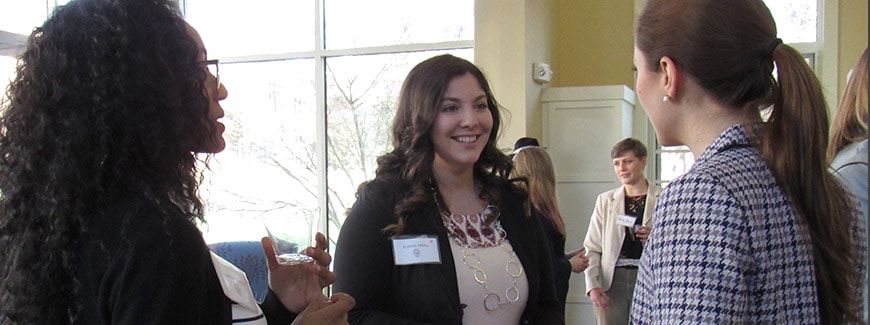 Photo of student talking with alumnae