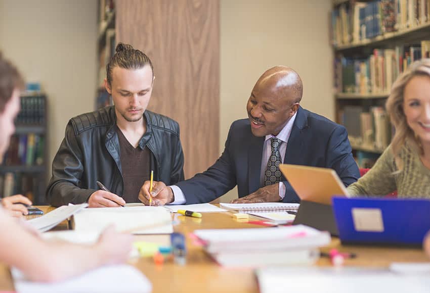 Photo of adult students in a library
