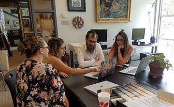 Interior design students present designs to the Rabbi