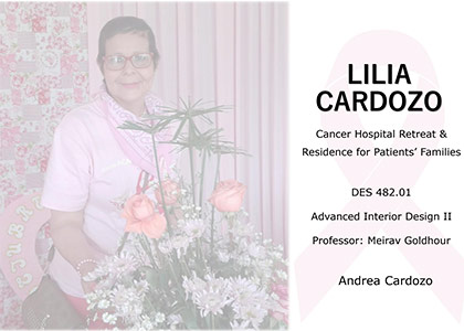 A smiling woman stands with flowers in a retreat space at the hospital.