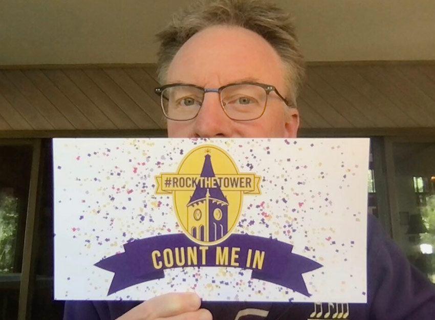 Photo of Chris Vaneman with Rock the Tower postcard