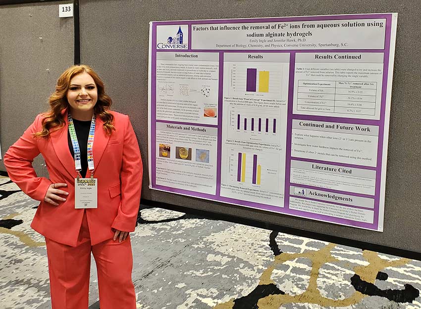 A Converse student presents their research poster.