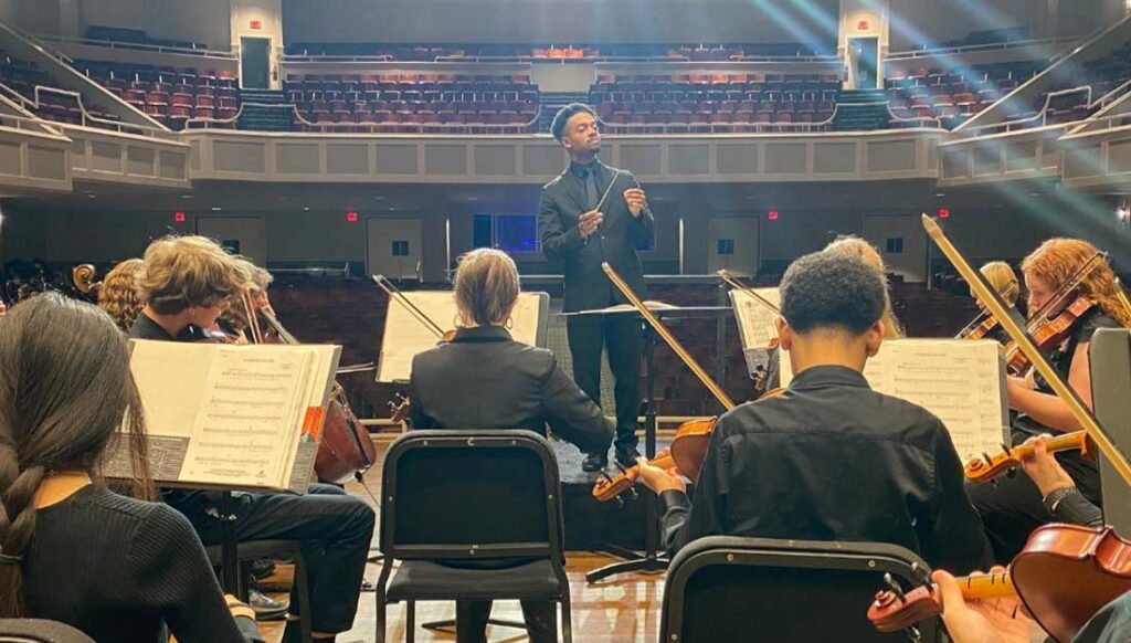 The youth orchestra performs for an audience