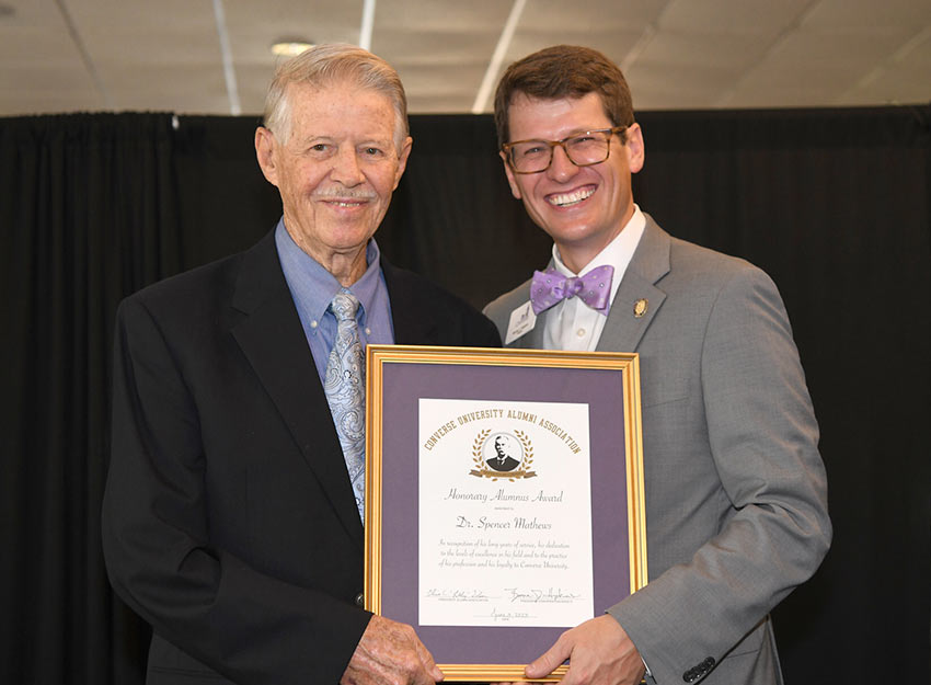 Dr. Mathews receives the Converse Honorary Alumnus Award from President Boone Hopkins