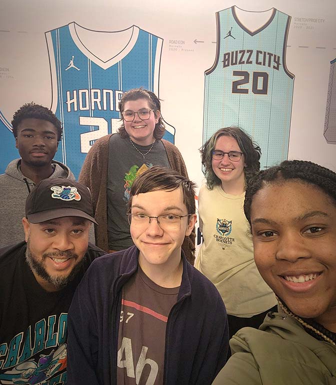 The MISTERS attend a Charlotte Hornets game.