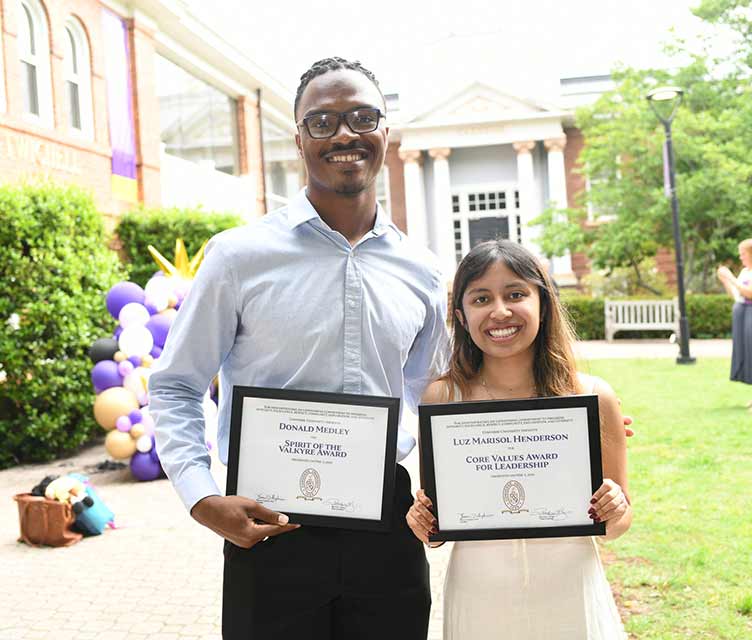 Donald Medley and Luz Marisol Henderson hold their awards.