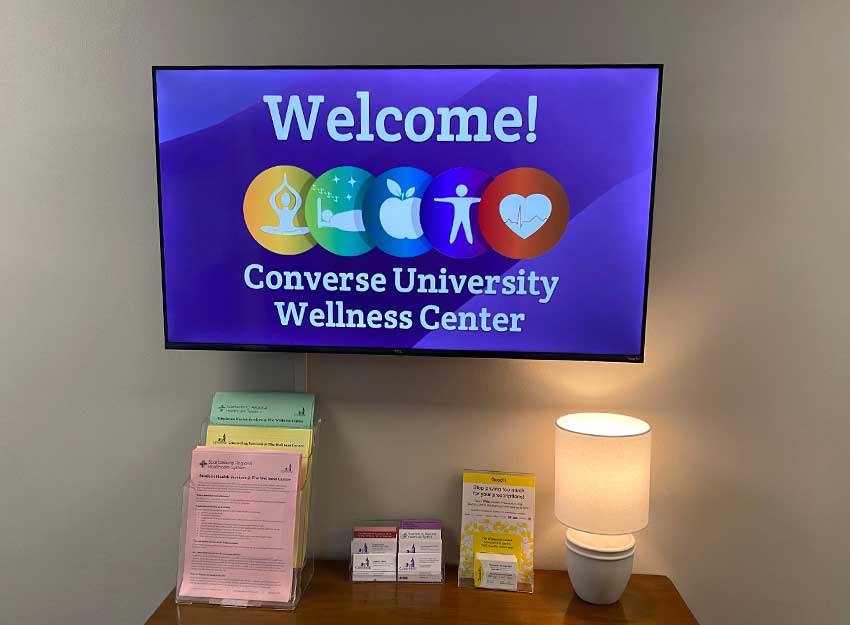 Photo of a TV in the Converse wellness center with the words "Welcome" Converse University Wellness Center" displayed.