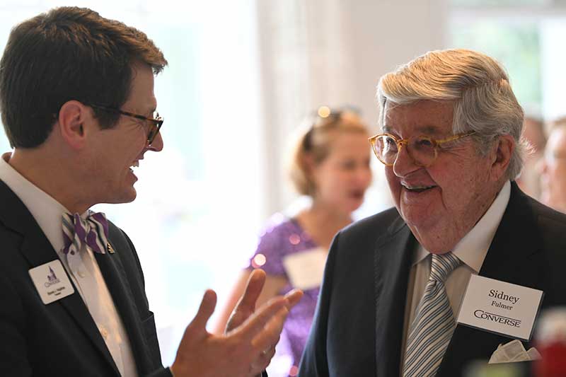 President Hopkins smiles while speaking with Converse donor Sydney Fulmer.