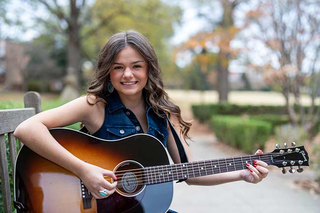 Jasmine Humphries plays her guitar on the Converse campus in South Carolina.