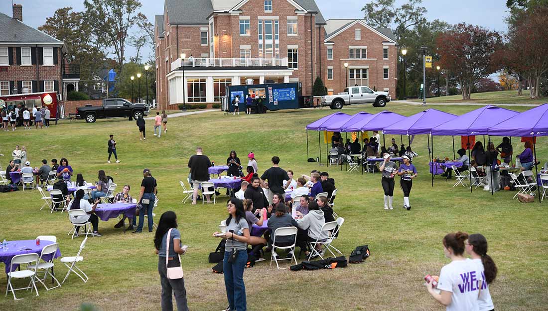 Students, family and friends have fun at an outdoor event at Converse's homecoming.