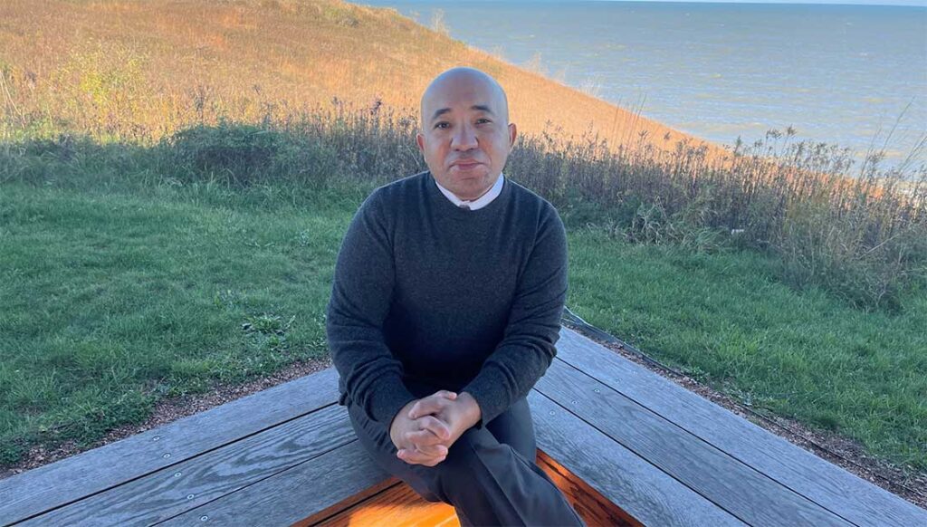 Outdoor portrait of Wael Farouk with a river in the background