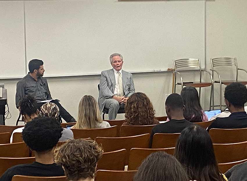 A guest speaker address Converse. students in the School of Business and Data Science.