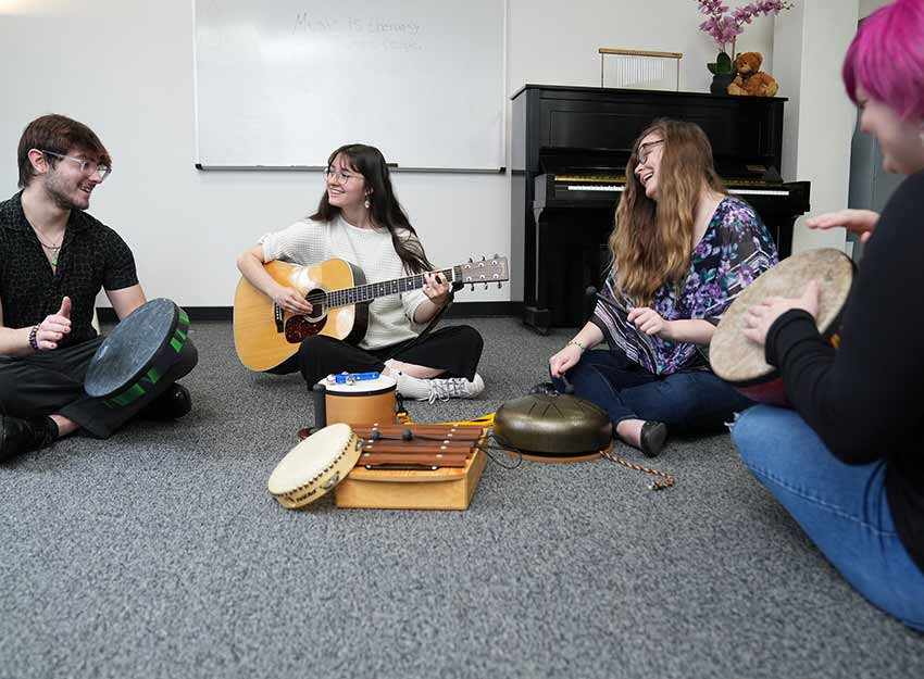 A group of Converse Music Therapy students in class
