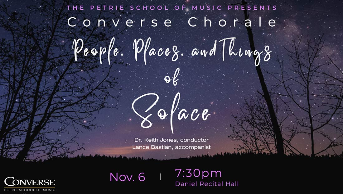 View of leafless trees at night against a starry sky.