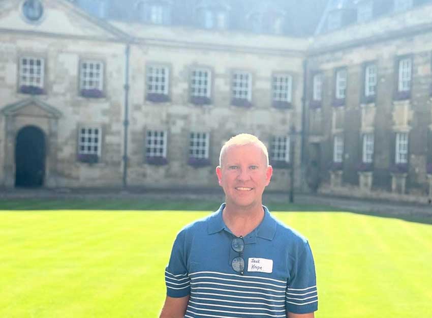 Dr. Jack Knipe in front of Peterhouse College, the oldest college at Cambridge, founded in the 1200s.