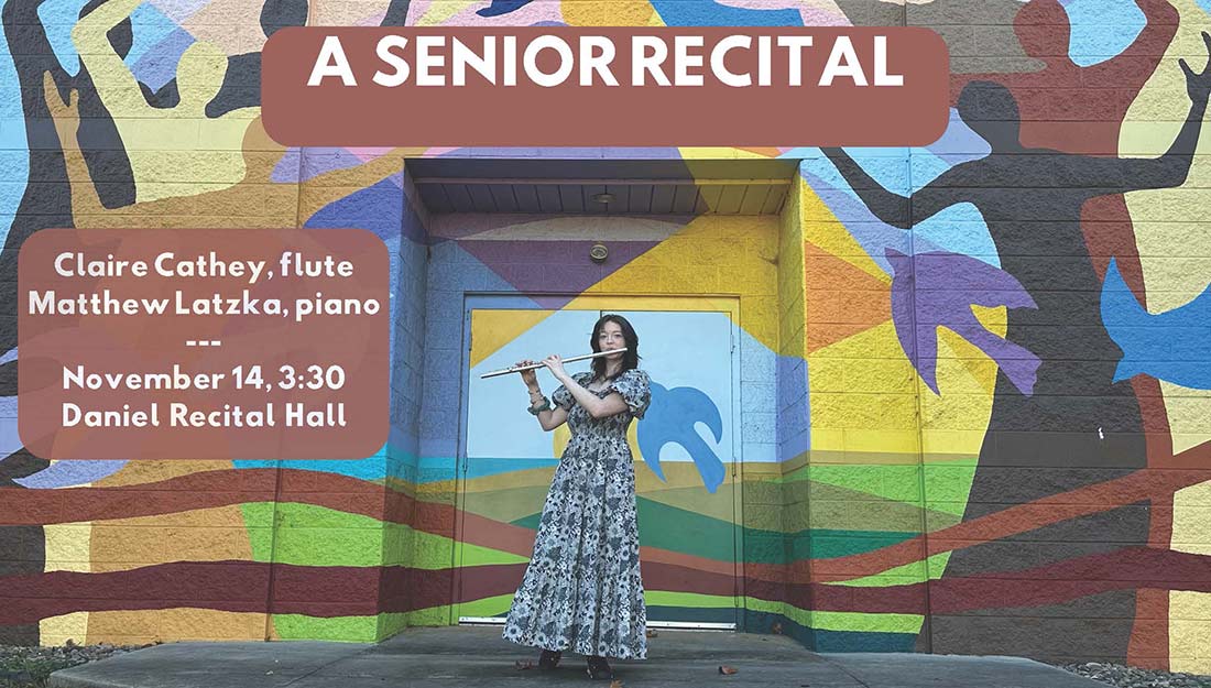 Claire Cathey playing the flute in front of a colorful brick wall outside.