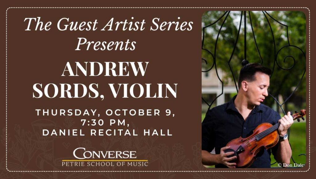 Andrew Sords stands outdoors with a violin