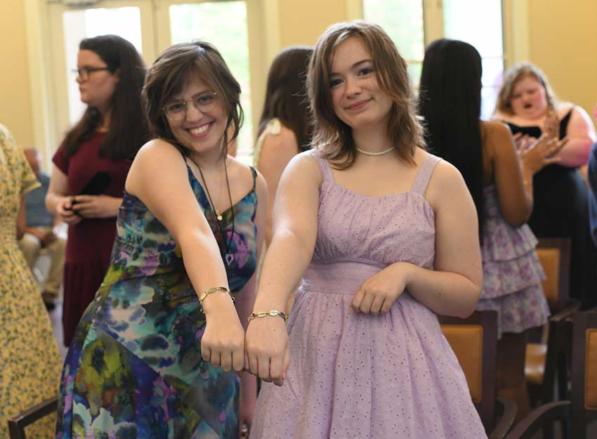 Converse students show off their bracelets