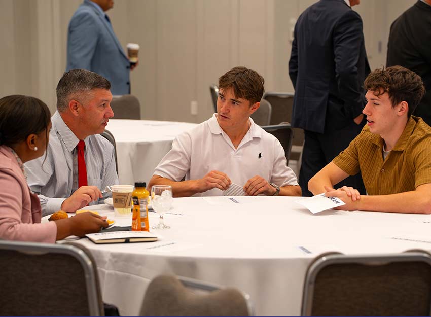 Converse students network with community leaders.