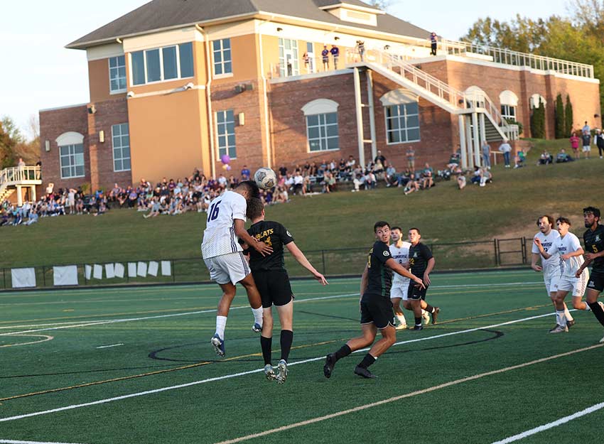 Bystanders watch a sporting event at Converse