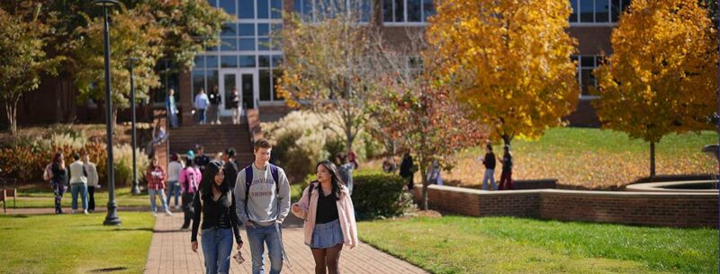 Students walking to class on the Converse campus on a fall day.