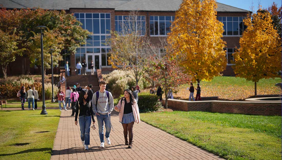 Students walking to class on the Converse campus on a fall day.
