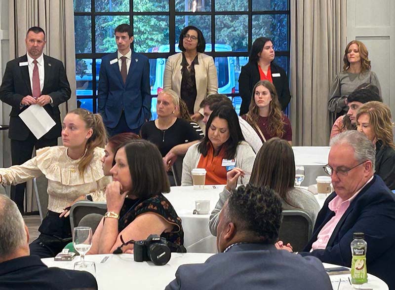 Converse students sit with community leaders at the networking event.