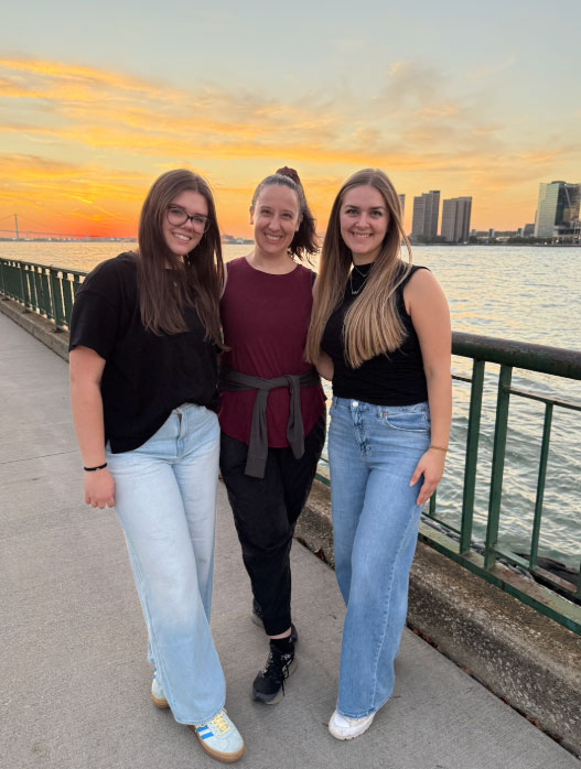 Converse students stand along the Detroit riverwalk during a break from the conference.