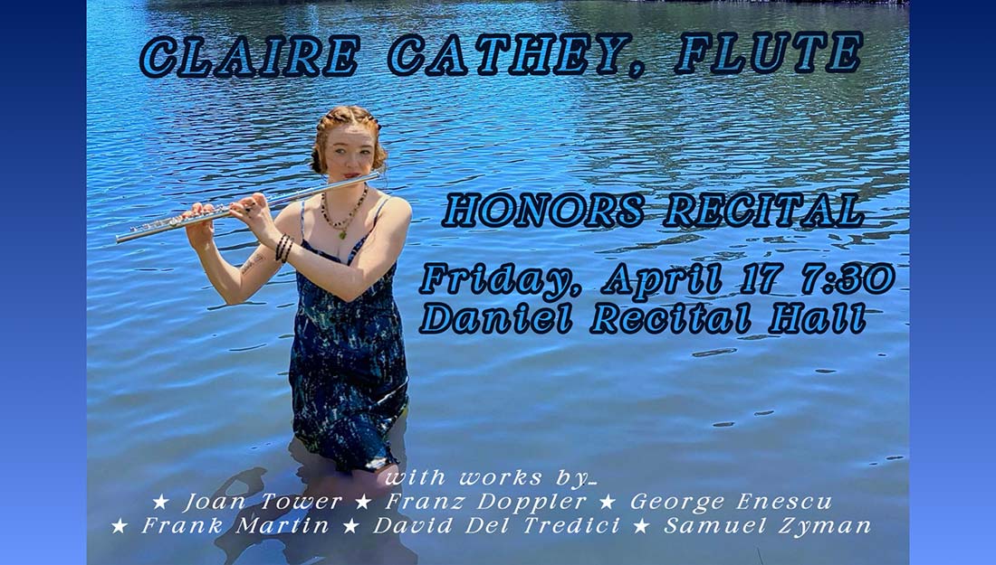 Cathey playing the flute while partially submerged in water.
