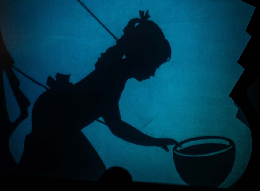 A shadow puppet performs in Converse's production of Metamorphosis