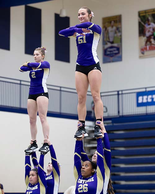 Kaylah performing with the Converse Acrobatics and Tumbling team.