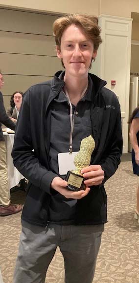 Perry Patterson holds the Boiled Peanut Award.