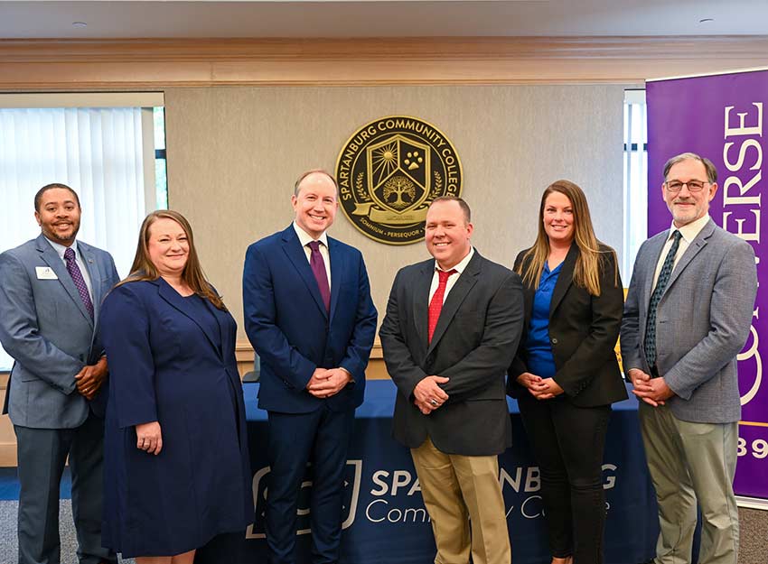 From left, Converse Vice President for Enrollment Management Jamie A. Grant-Ponce, Ed.D, Converse Provost and Vice President for Student Success William S. Case, Ph.D., SCC Vice President for Academic Affairs William Brothers, D.B.A., and SCC Dean of Educational Partnerships Amber Kreger, M.B.A. at the agreement signing.