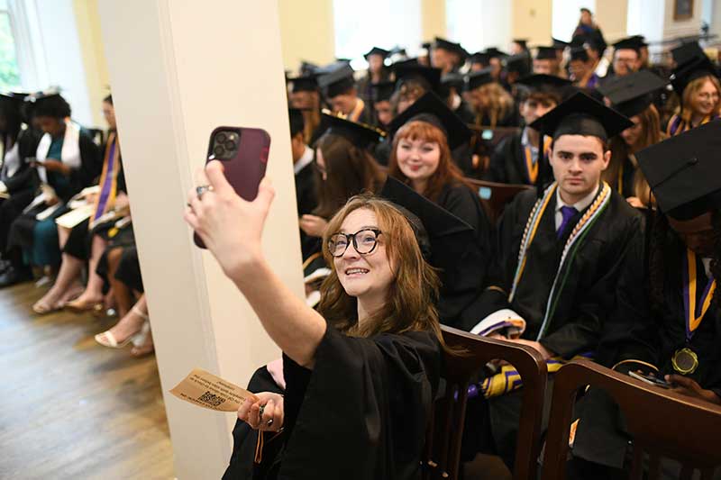 Members of the Class of 2026 take a selfie.