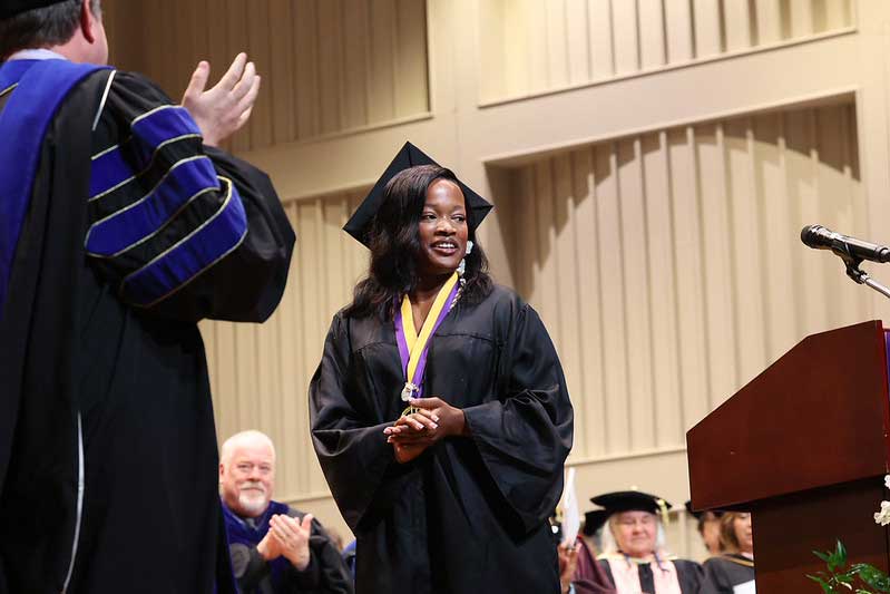 D'Asia smiles at the applause following her speech.