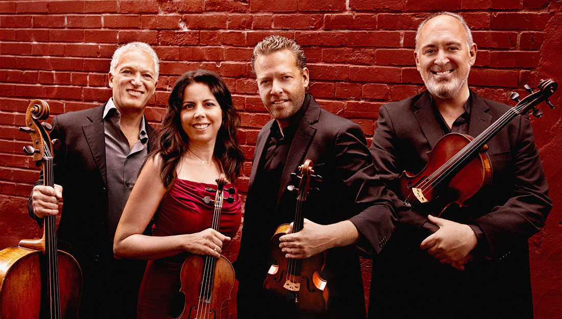 Members of the PACIFICA QUARTET pose with their instruments.