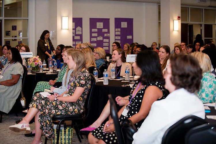 Attendees listen intently at the leadership conference.