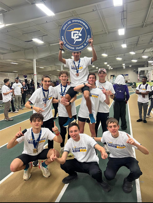 Jaxon celebrates with the Converse Track and Field team.