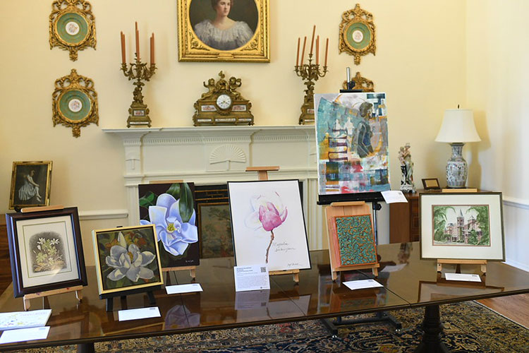 Various works of art available at the auction on display.