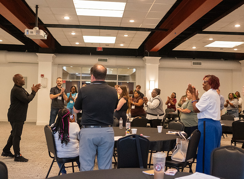 A speaker engages with the audience at the Food Insecurity summit.