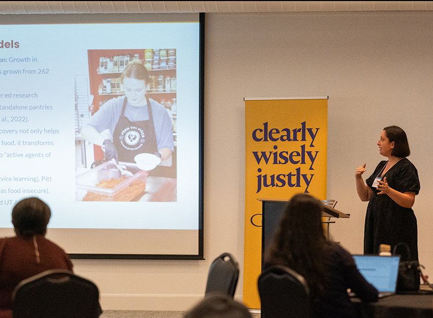 A presenter shows a slide during the food insecurity conference.